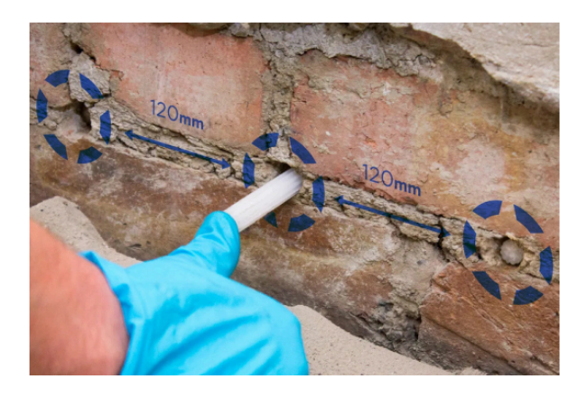 Failure caused by low strength or insufficient damp proofing cream in walls.