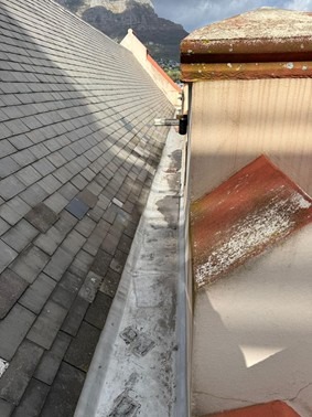 Existing wooden box gutter condition before waterproofing treatment